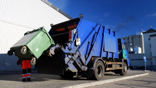 Enclosed skip stationed on a residential site in Sydenham
