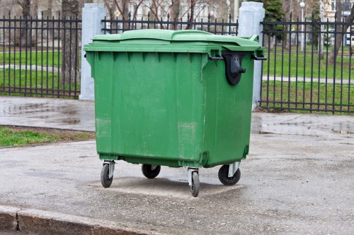 Skip truck delivering a container